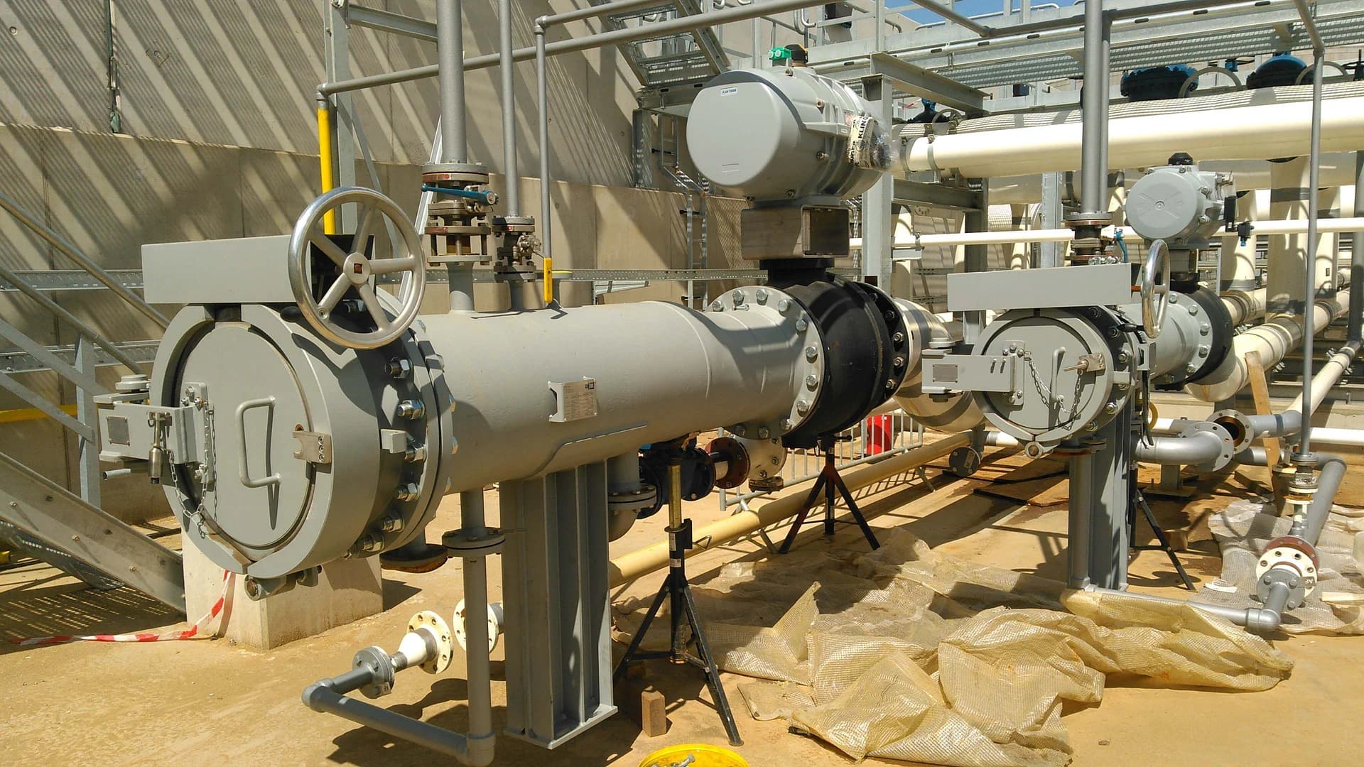 engineering, design and fabrication of high pressure skid mounted pig launcher and receiver system including with quick opening closures, fully integrated interlocking system, valves, instrumentation, and electrical.
